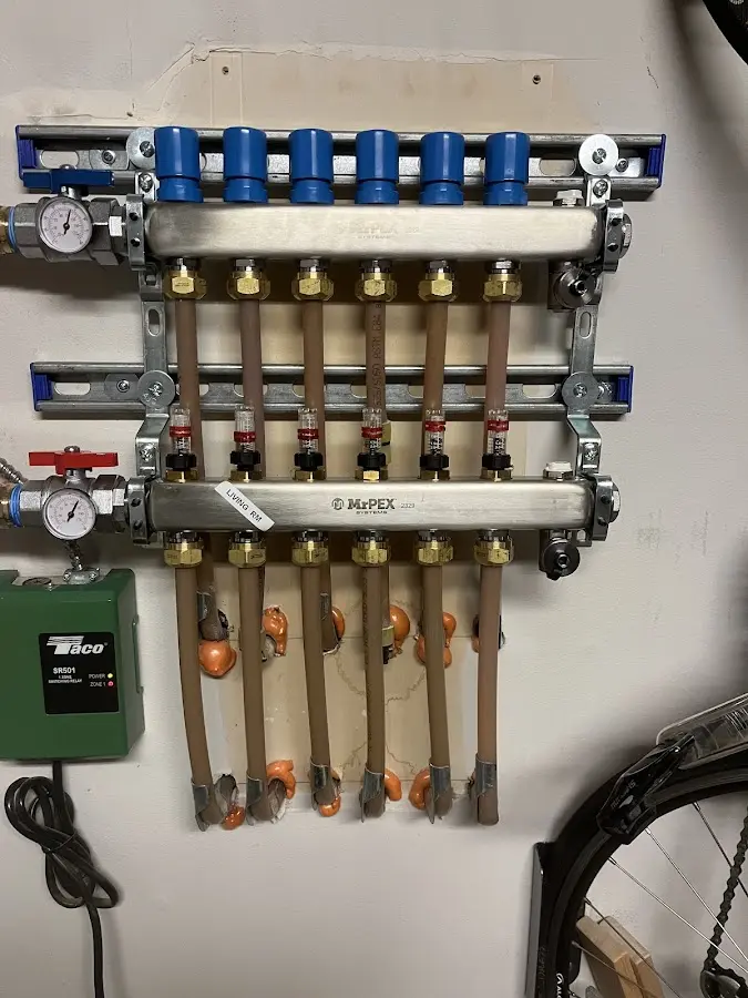 Plumber performing Water Heater Repair at a residential property in Wales